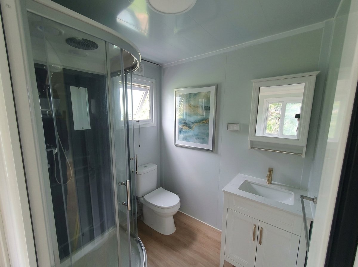 Iris bathroom — shower, toilet and vanity