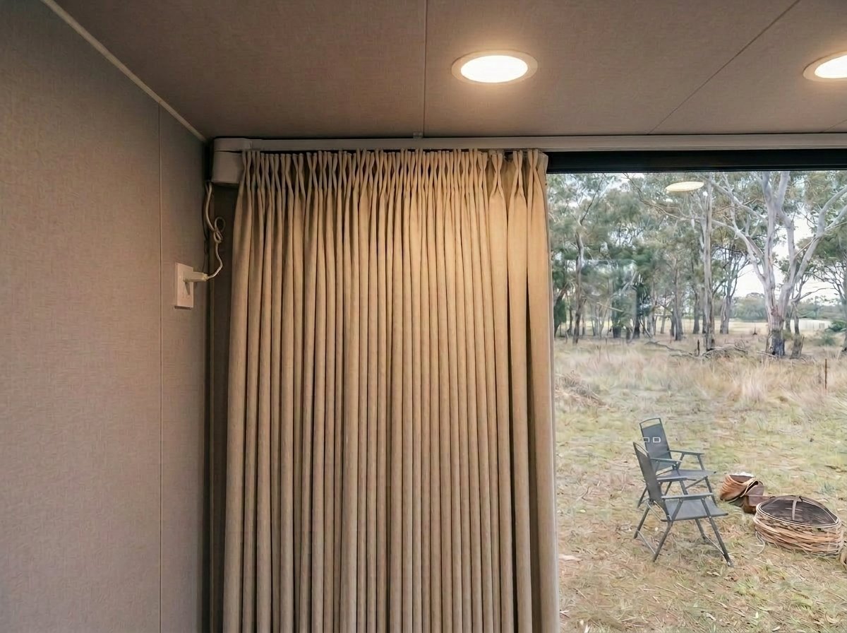 Sylvia living end with full-height drapery for privacy